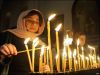 Грузия: взгляд изнутри (Женщины зажигают свечи в церкви в Грузии в ночь на 7 января) Женщины зажигают све…