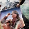 Проблема внешней политики 'с лучшими намерениями' (Портрет Муамара Каддафи, плакаты с его цитатами и Зеленая книга Каддафи | © РИА Новости, Андрей Стенин) Портрет Муамара Кадд…