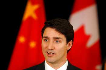 Canadian Prime Minister Justin Trudeau speaks to the media at a hotel in Beijing, China on Dec. 5, 2017 (AP Photo/Ng Han Guan, File) Canadian Prime Minis…