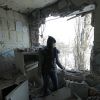'Путин помогал нам в тяжелые времена' (Девушка в квартире, разрушенной от попадание снаряда в результате обстрела, в Киевском районе Донецк…) Девушка в квартире, …